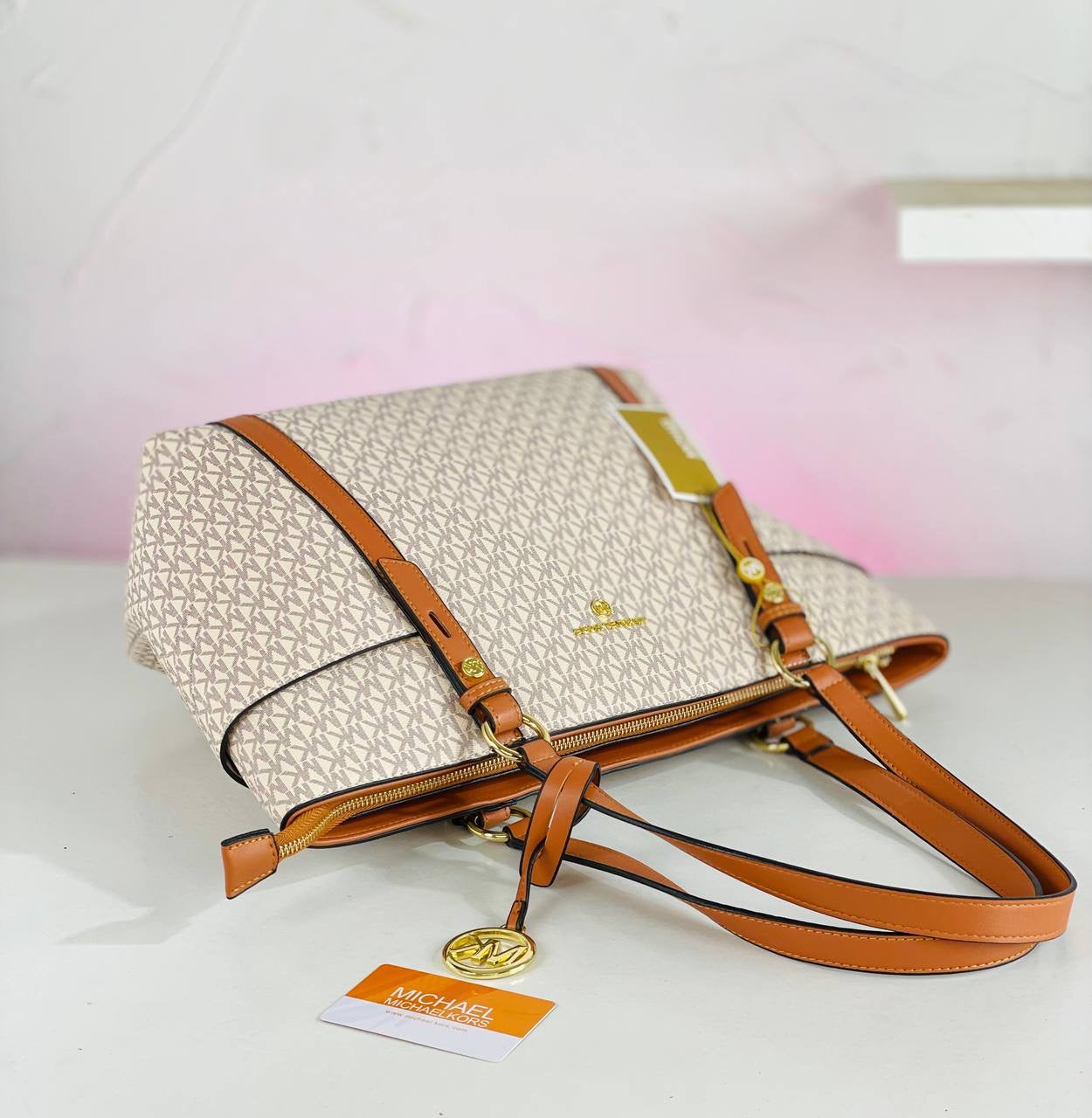 Michael Kors ( MK )